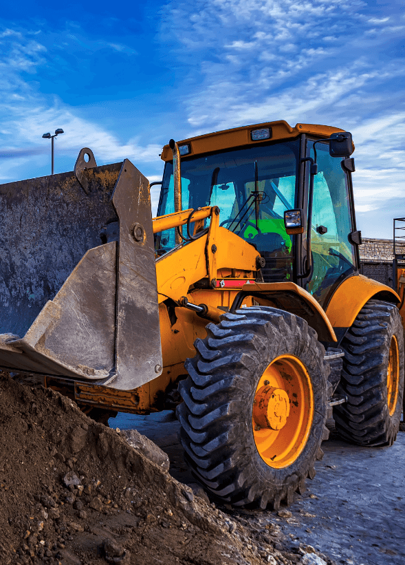 Diesel mechanics carrying out earthmoving maintenance on heavy plant machinery on a mine site in Queensland